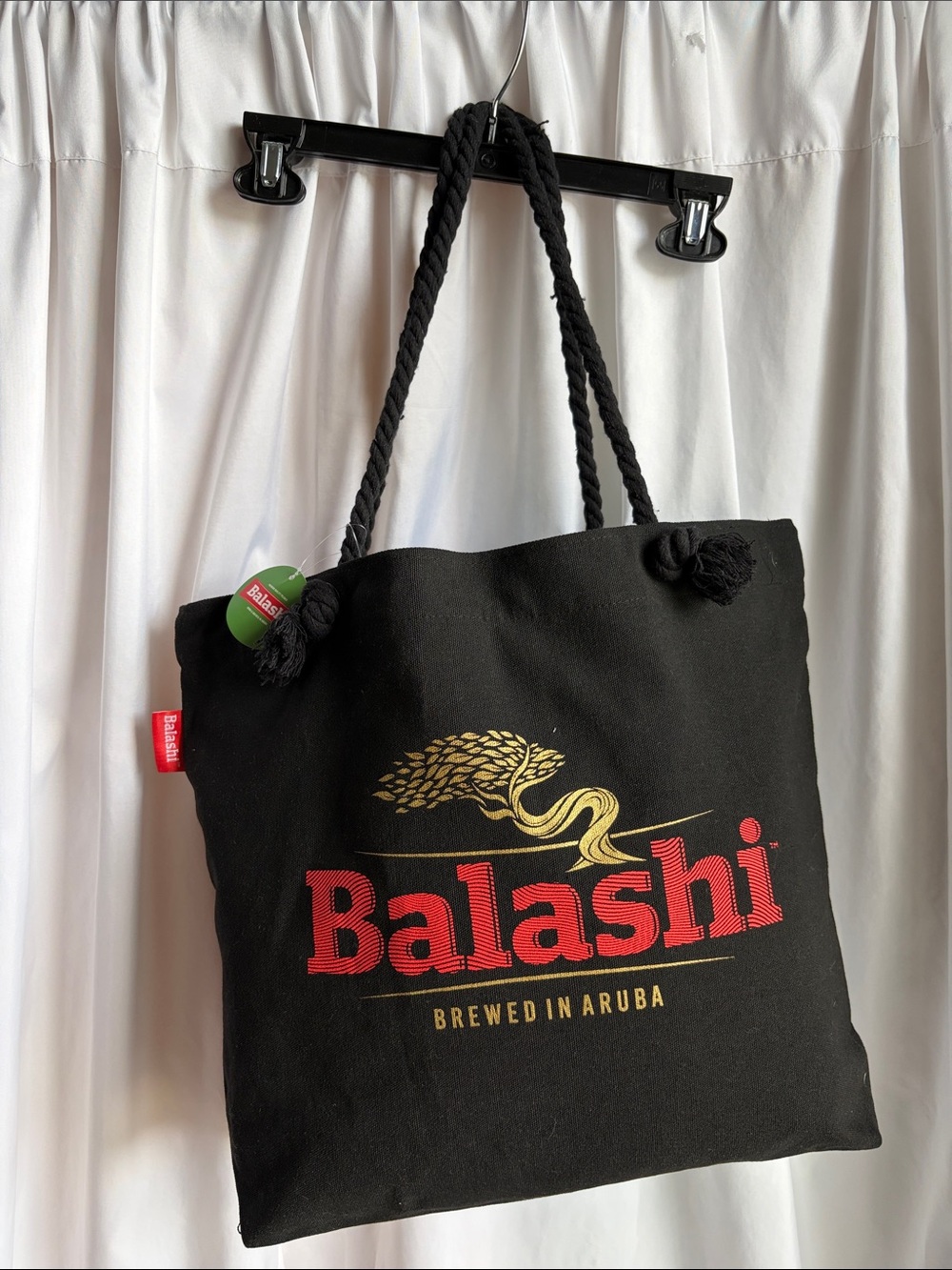 Black Canvas Tote with Red Logo and Gold Accent